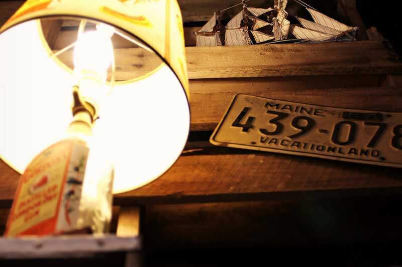 A lamp made from a whiskey bottle and a decorative model ship at Jack Brown's, Murfreesboro, TN.