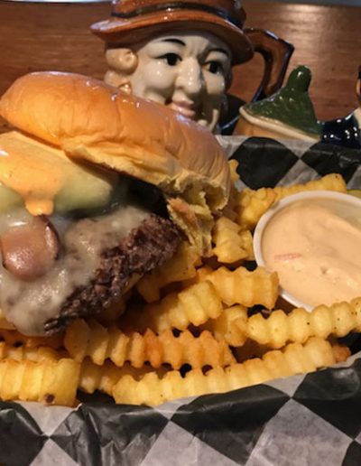 A burger with fries and a pickle at Jack Brown's Kill Devil Hills, NC.
